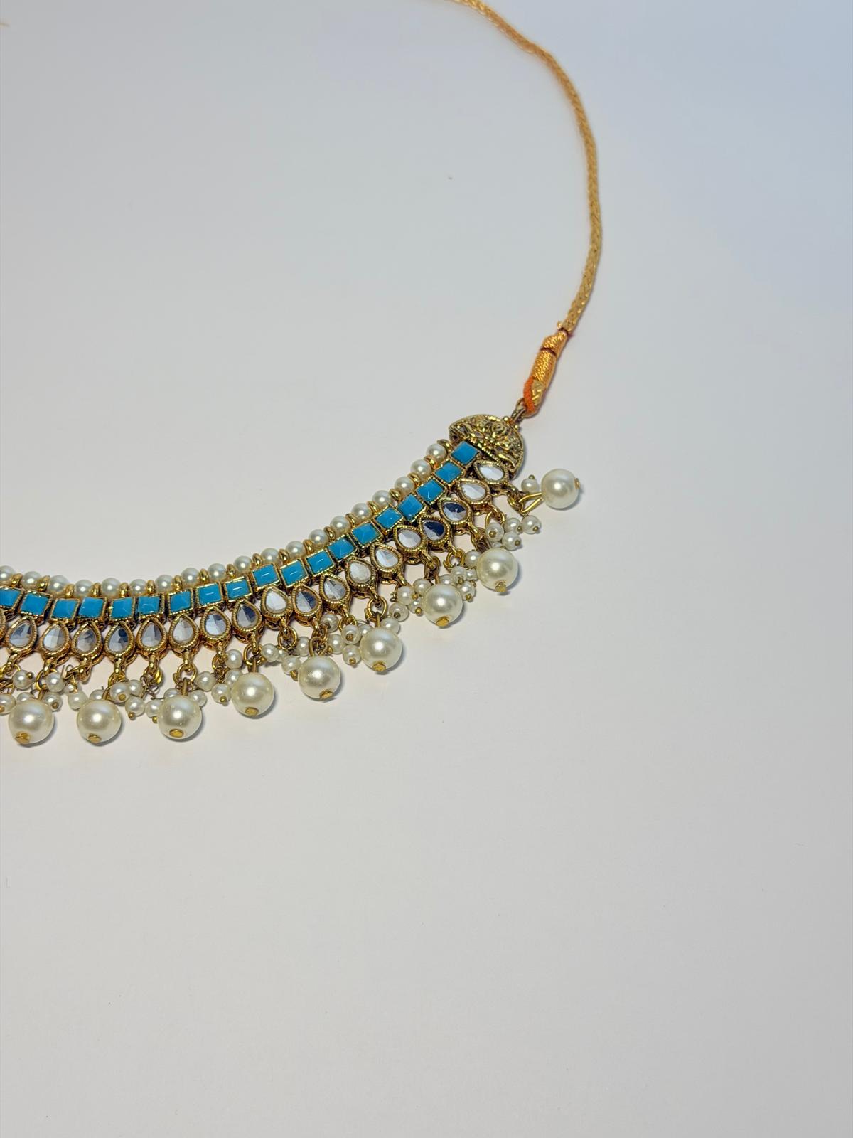 Gold‑plated choker set | matching earrings & a stylish maang tikka