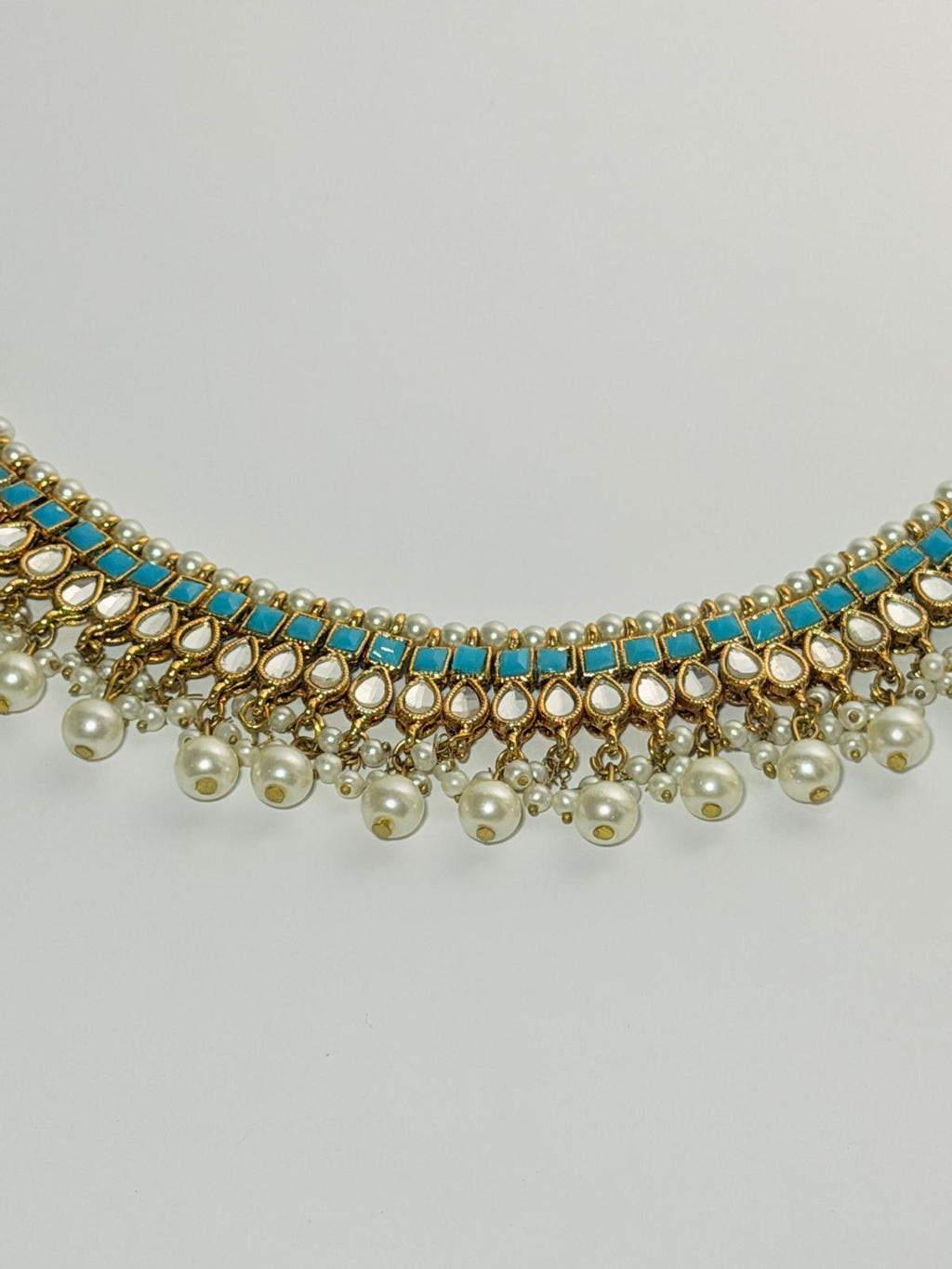 Gold‑plated choker set | matching earrings & a stylish maang tikka