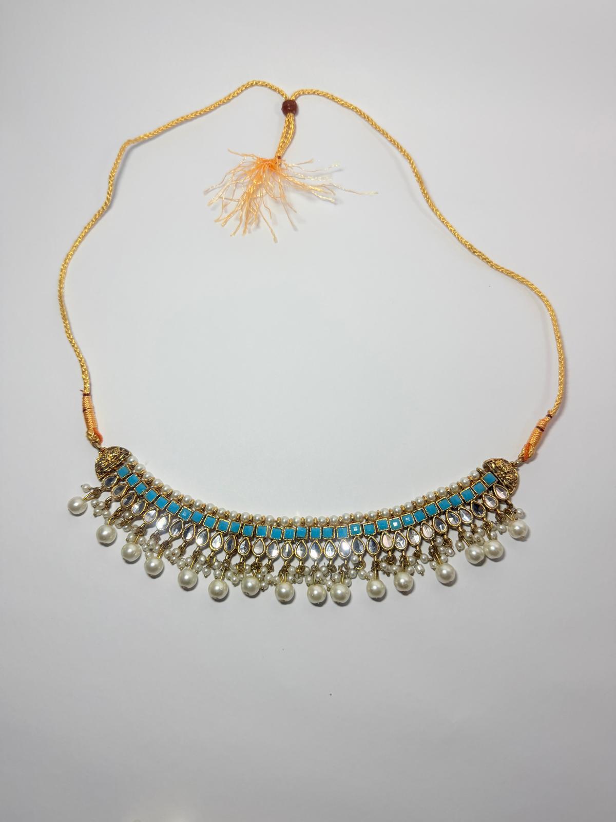 Gold‑plated choker set | matching earrings & a stylish maang tikka