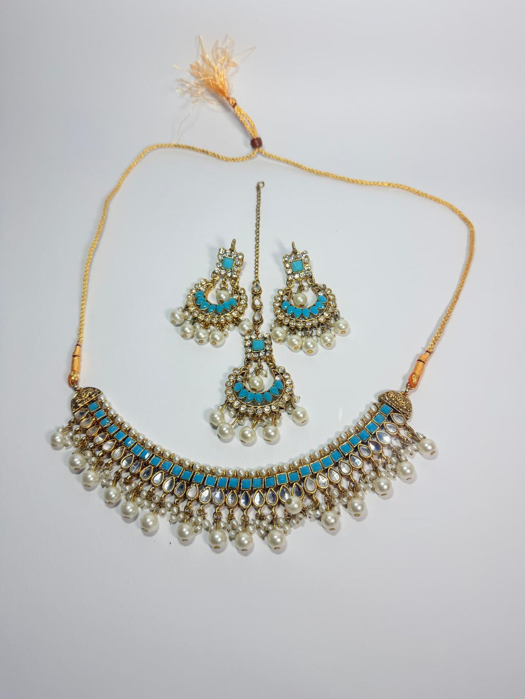 Gold‑plated choker set | matching earrings & a stylish maang tikka