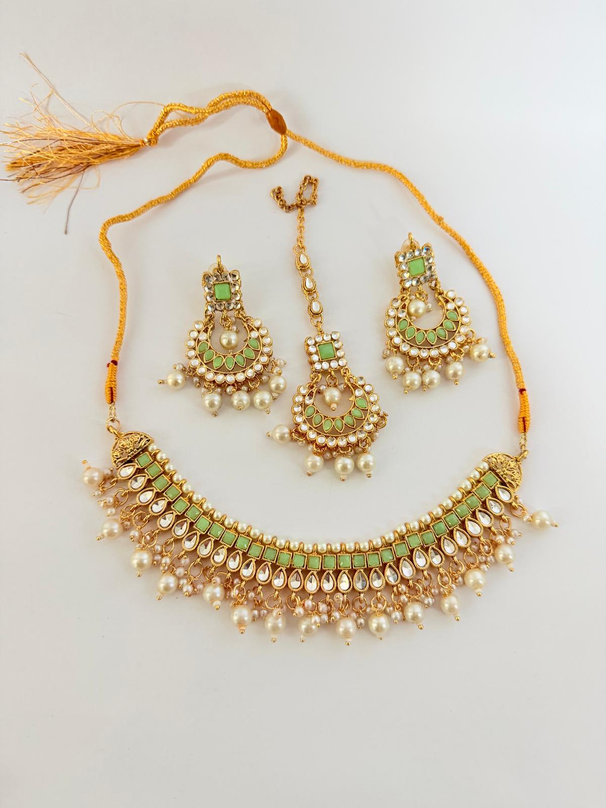 Stunning gold-toned necklace set with mint green stones & pearl