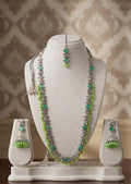 Stunning silver-toned necklace set with vibrant green gemstones