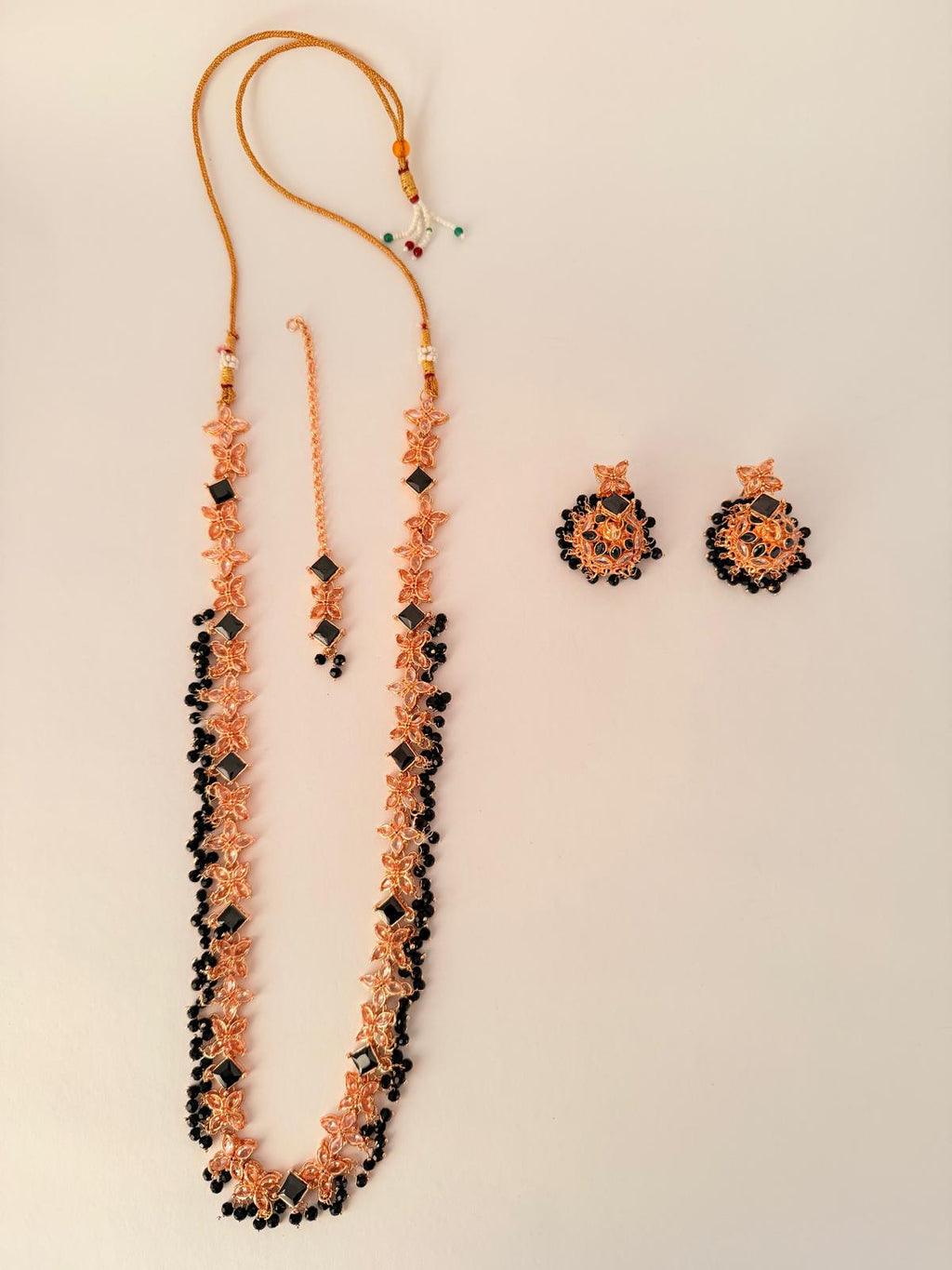 Stunning rose‑gold necklace set with black stone accents