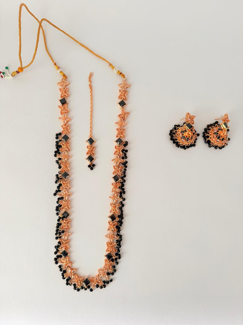 Stunning rose‑gold necklace set with black stone accents